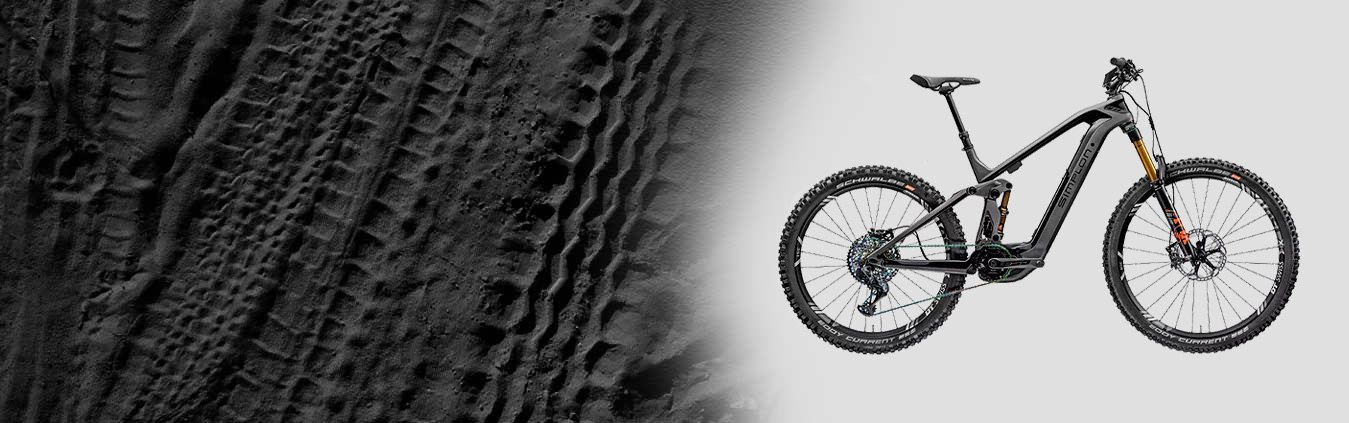 Mountainbike auf Reifenspuren Hintergrund
